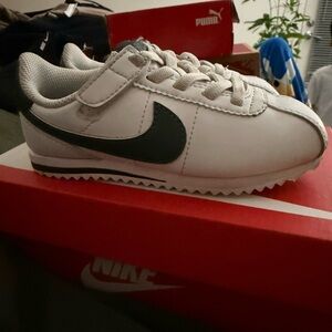 Nike Kids White Sneaker with Black Swoosh